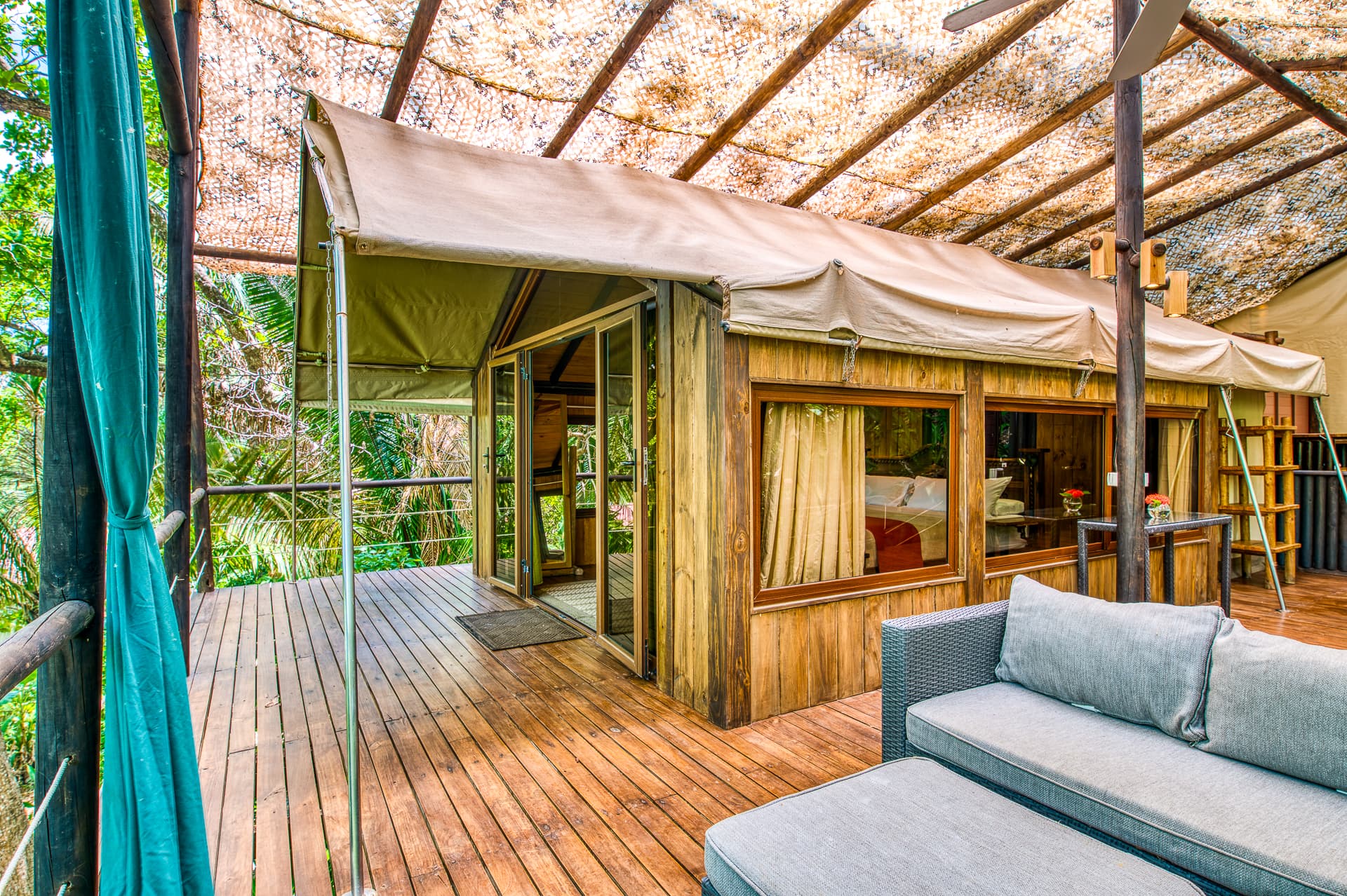 Tree Top Canopy terrace with covered, open-air seating area with jungle views