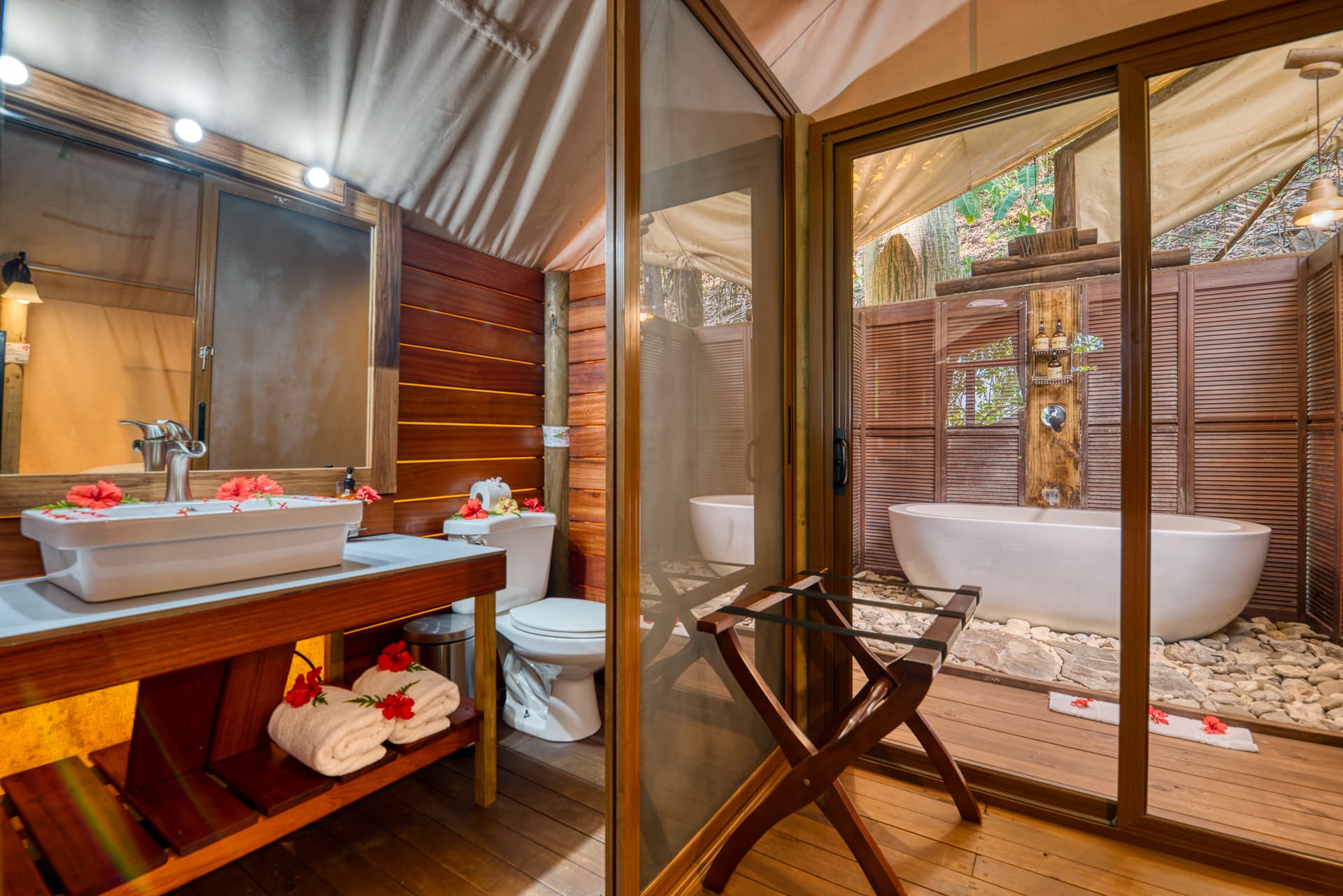 Tree Top Canopy Bathroom with pedestal sink and covered outdoor shower