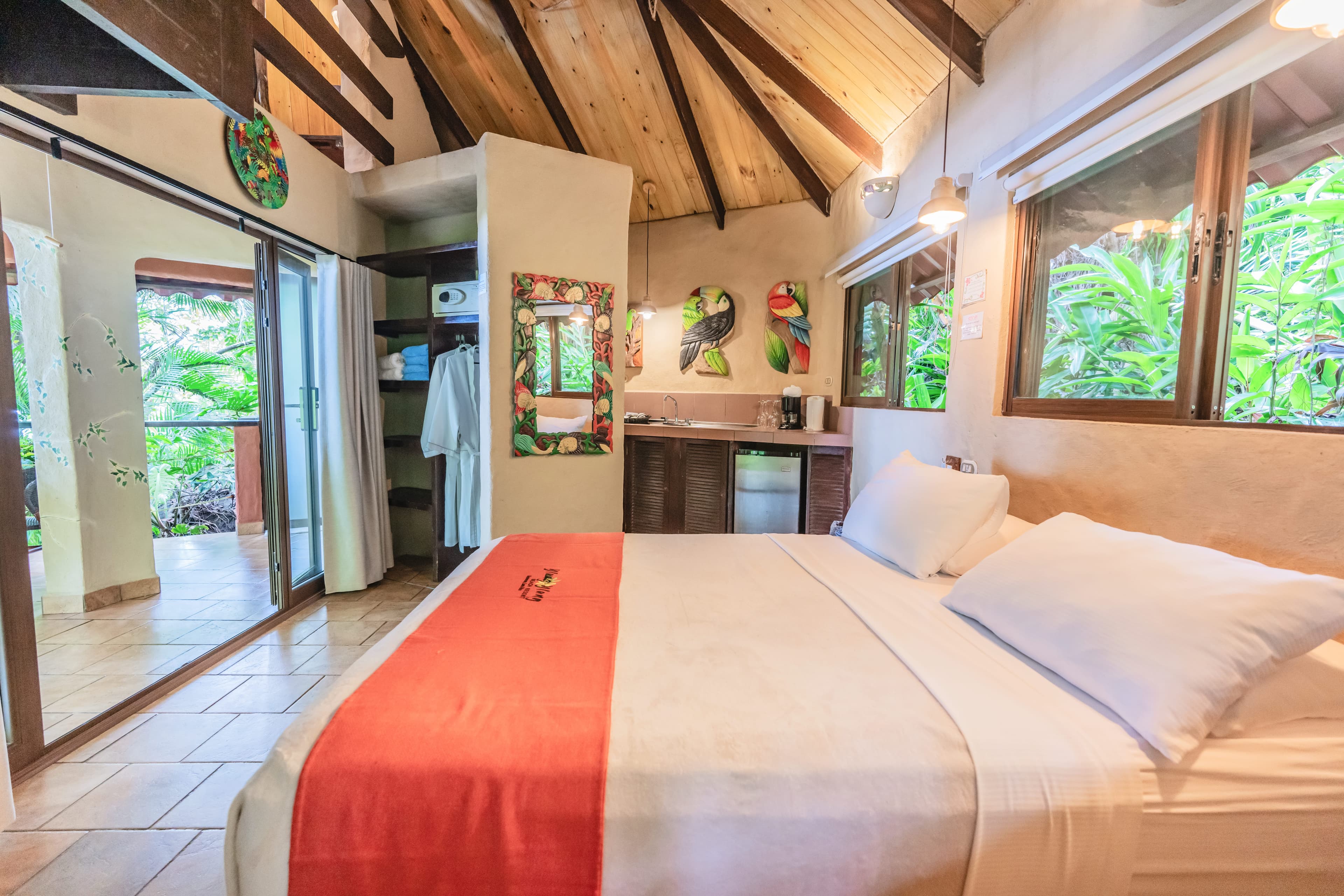 Coco Joe's Bungalow Interior with vaulted ceilings and sliding doors leading to sitting area on private patio