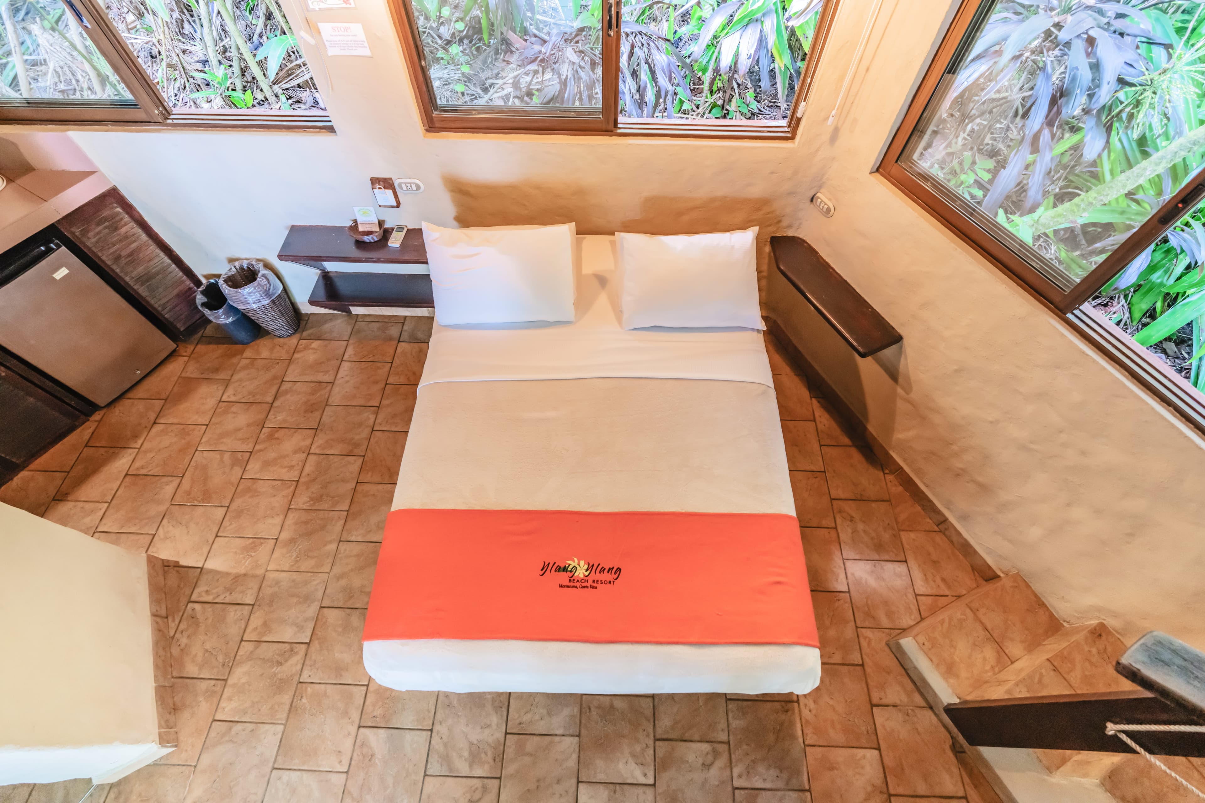 View from the loft looking down to main floor with bed and kitchette area