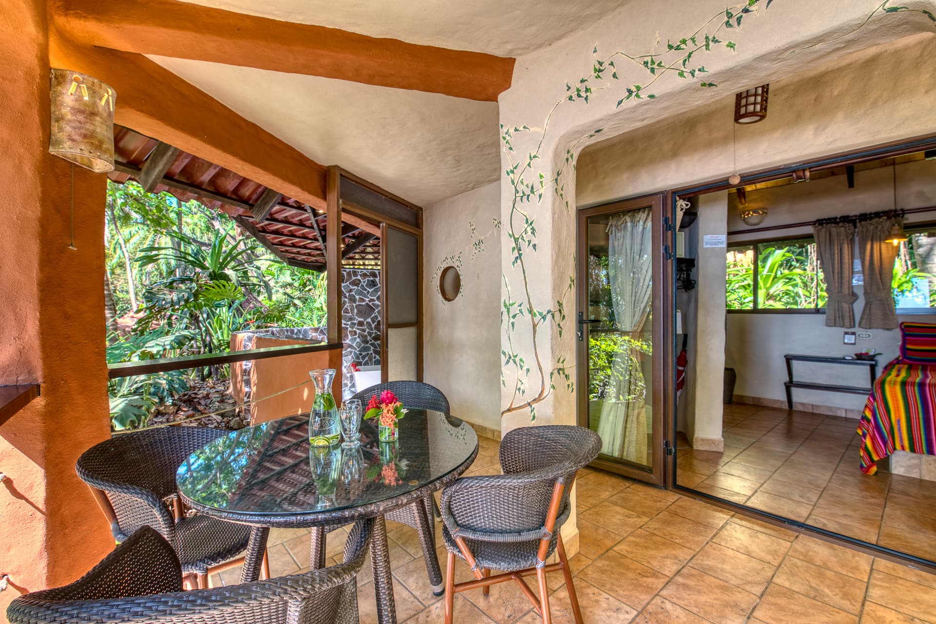 Sitting area on private terrace with round table and chairs for four