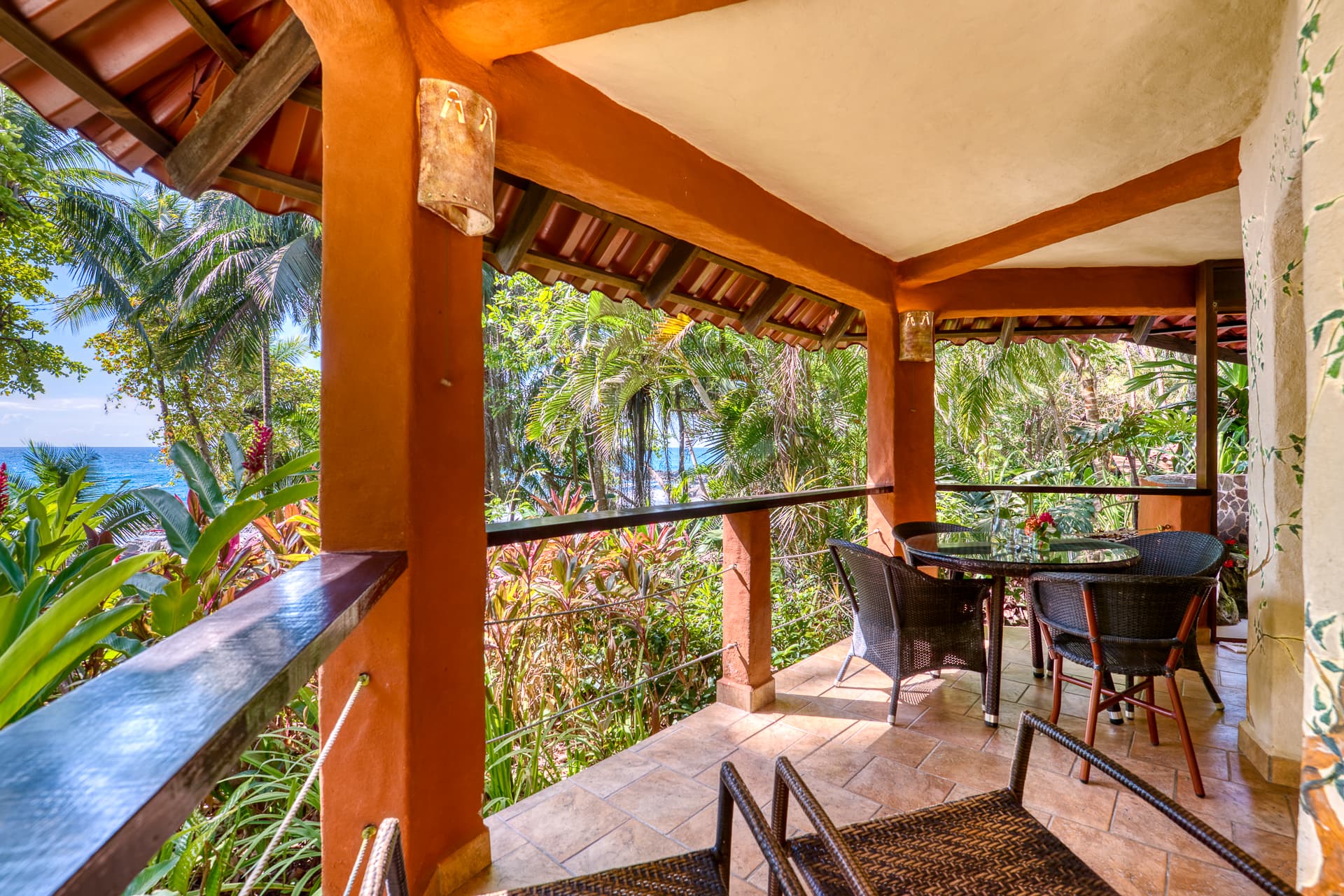 Private terrace at bungalow with sitting area and beach and jungle views