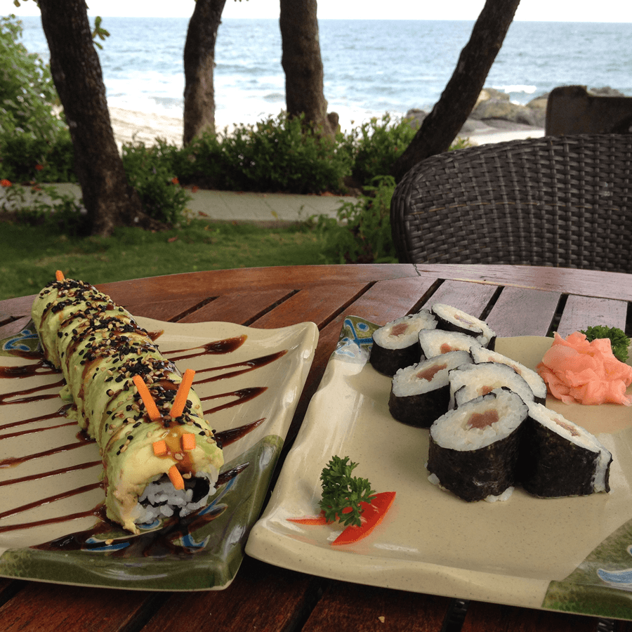 Various plates of different types of sushi