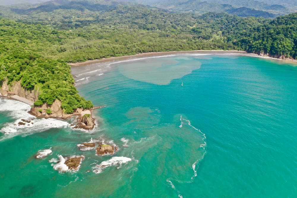 Crystal turquoise blue waters along a tropical coastline