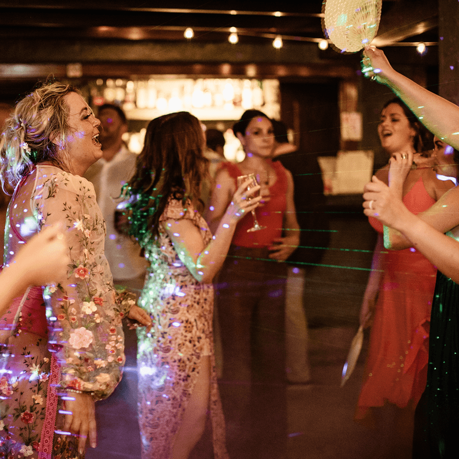 Bride and others on dance floor with disco lights