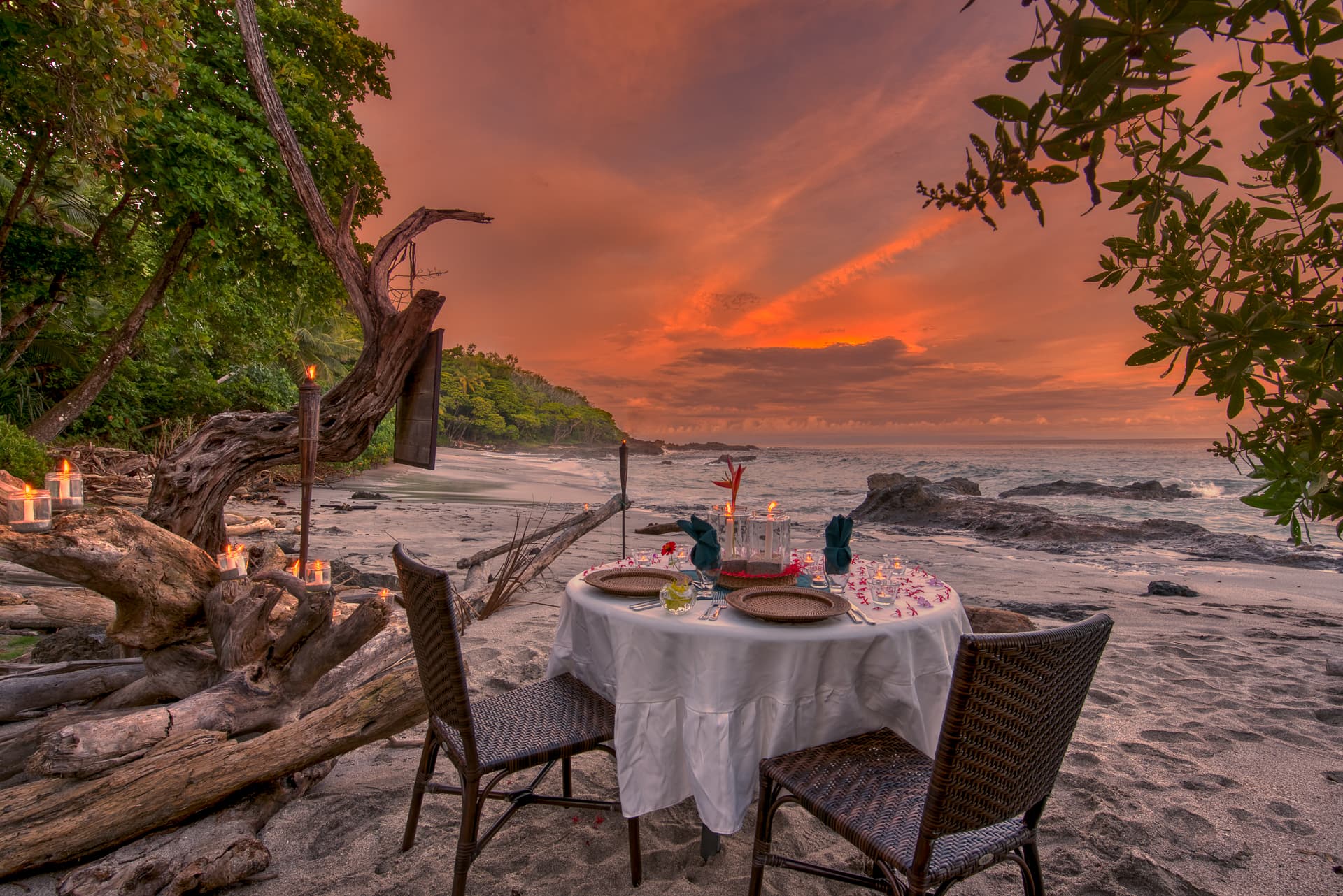 exterior table with ocean in background at sunset